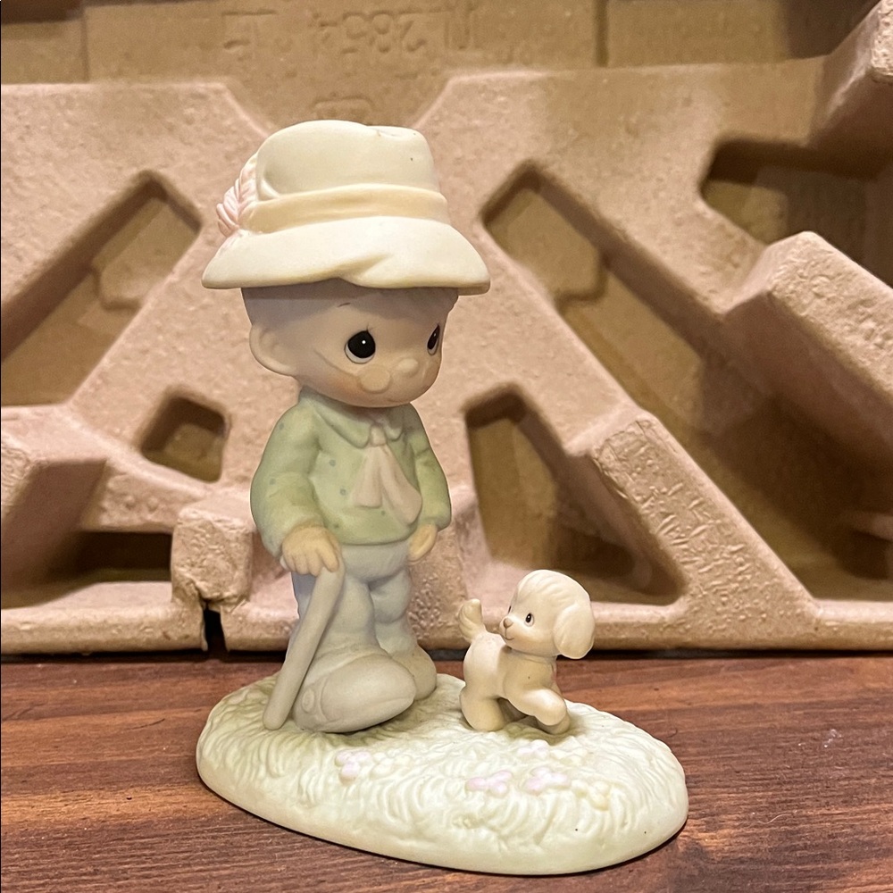 Precious Moments Figurine with Green and Cream Accents